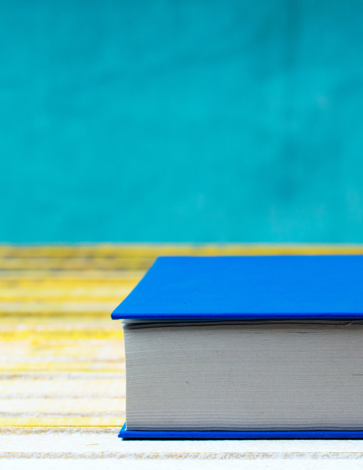 Book on table with blue background