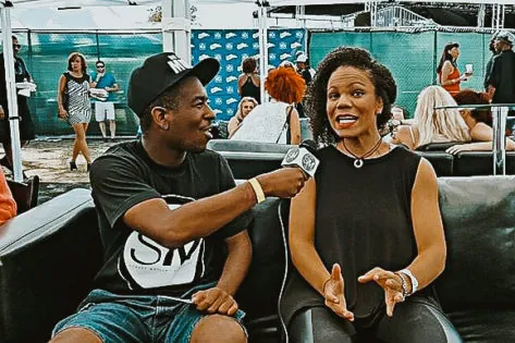 Picture of Martay, artist and songwriter that we helped win a campaign and open for Snoop Dogg, doing an interview