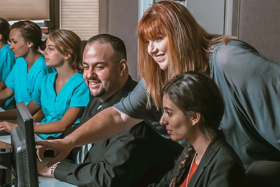 Students and teacher at Central Coast College, a past client of Helps2.