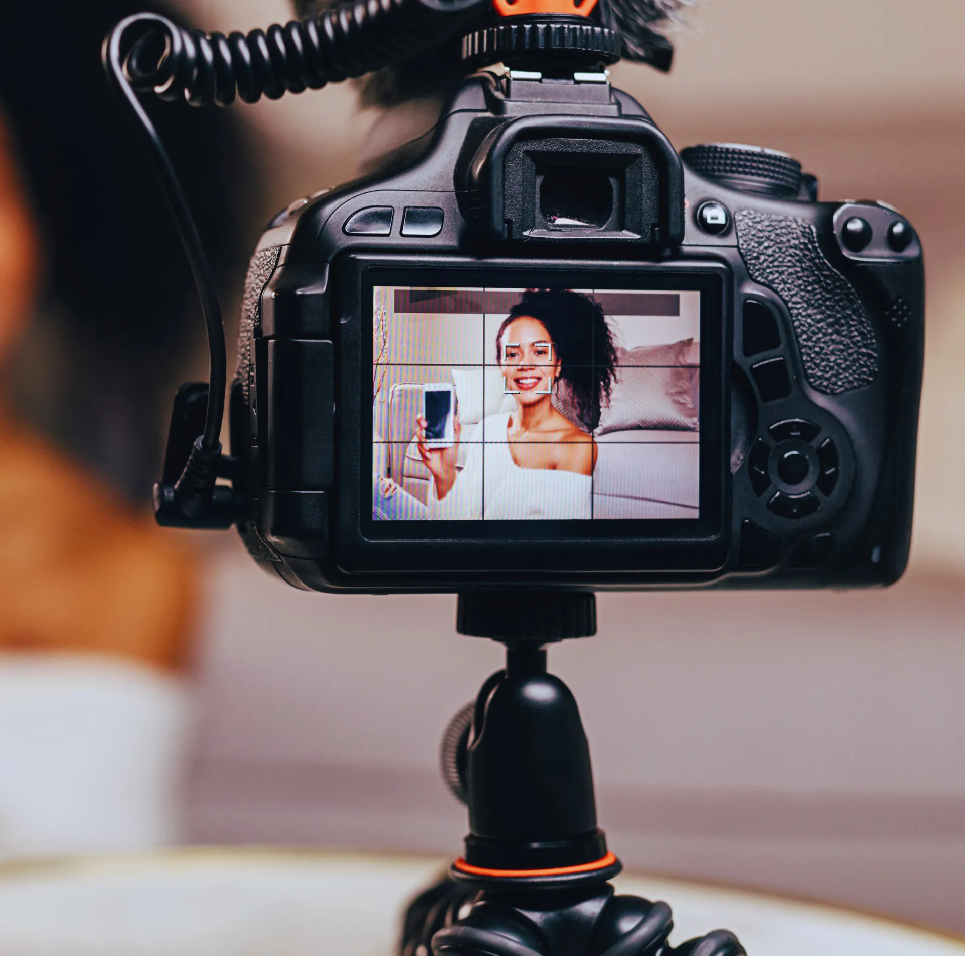 Image of woman creating content with her camera