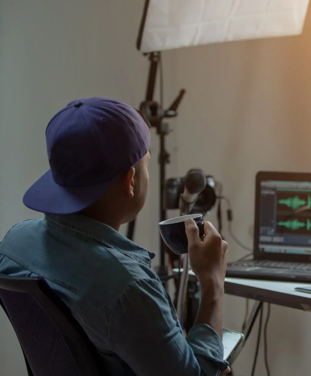 Audio Content Creator making audio content in his office.