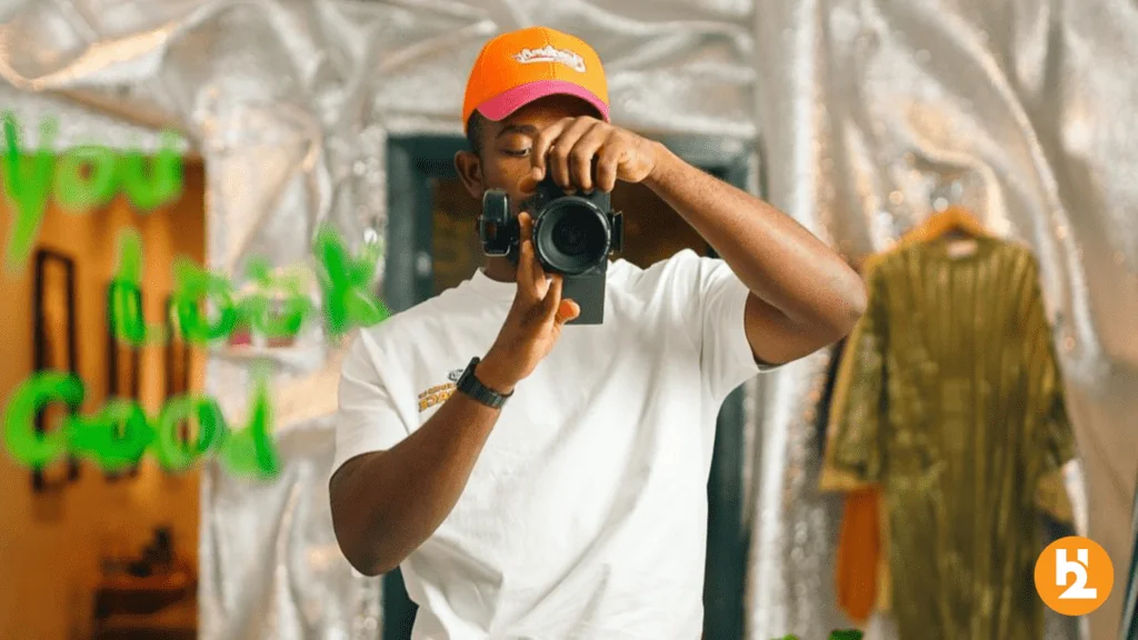 Photographer Ben Iwara taking a photo in the mirror